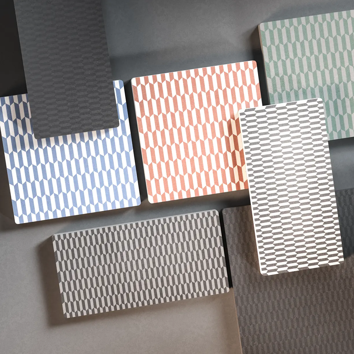 Varios azulejos efecto cemento en colores blanco, gris y negro