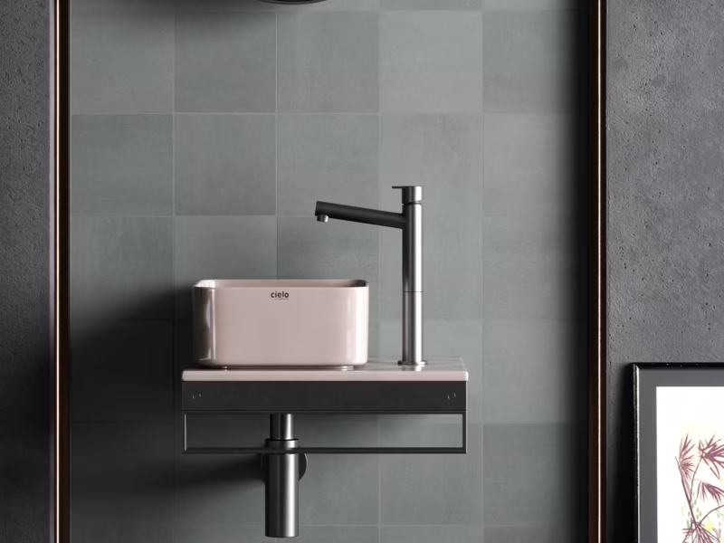 Baño de diseño moderno con paredes de azulejos monocolor de cemento verde basalto de estética orgánica y minimalista