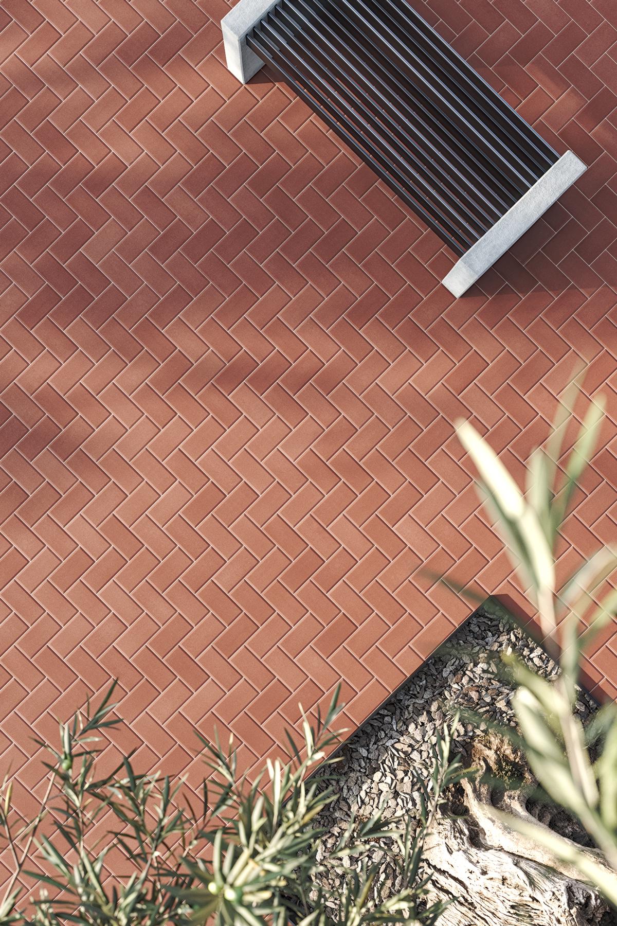 Suelo terraza realizada con baldosas de exterior tipo adoquín