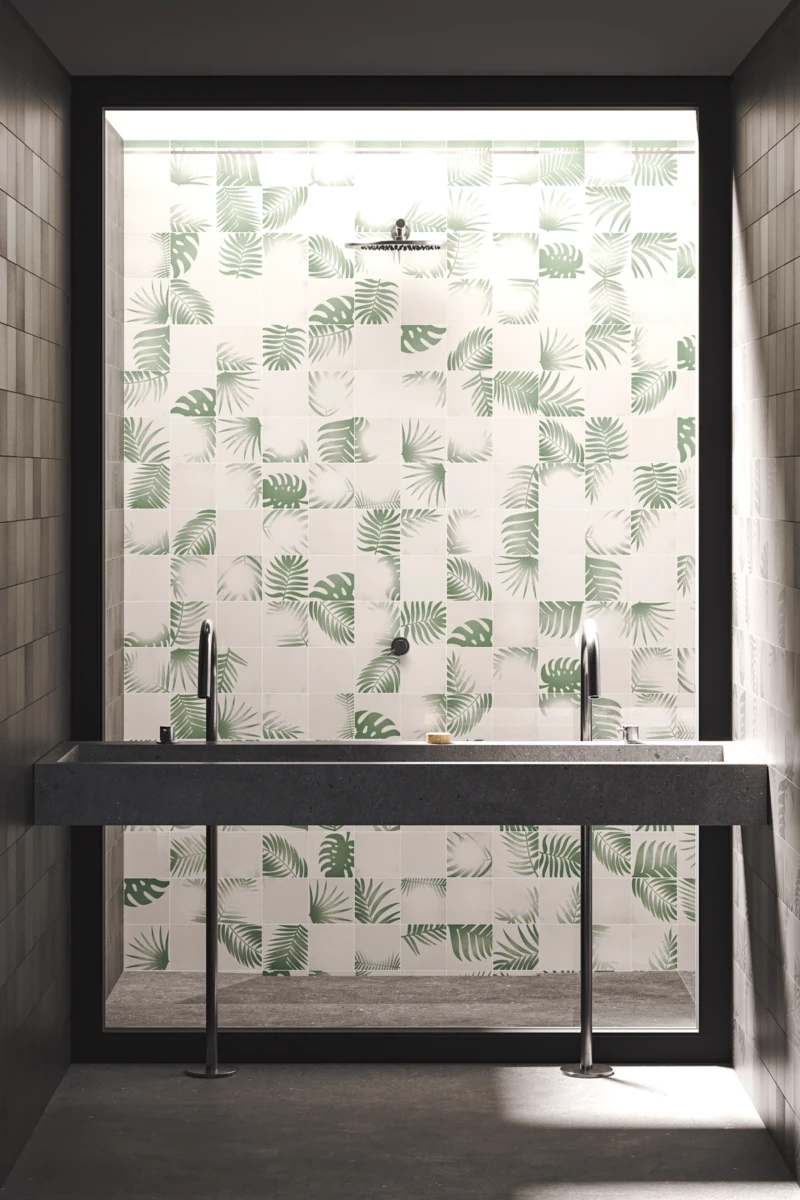 Pared del baño hecha con azulejos blancos y diseño en color verde